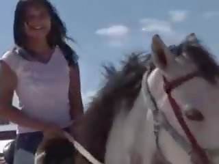 Chick from Thailand riding a horse